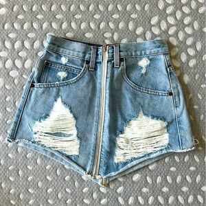 Carmar Denim medium-wash zip up mini skirt with rips. Size 25